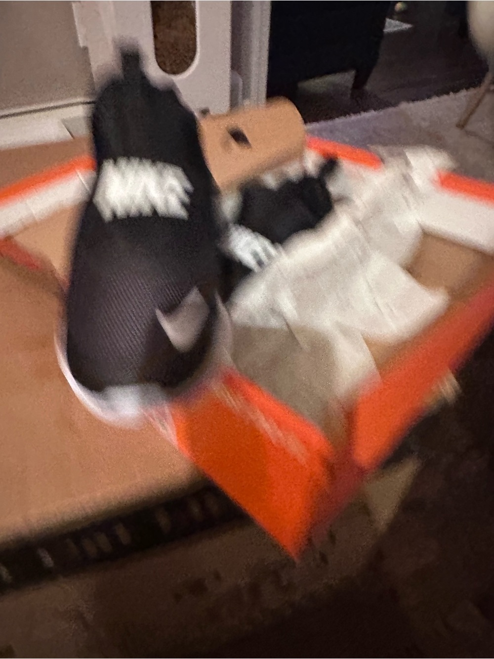 Nike Kids Black Slip-On Sneakers with White Swoosh Logo